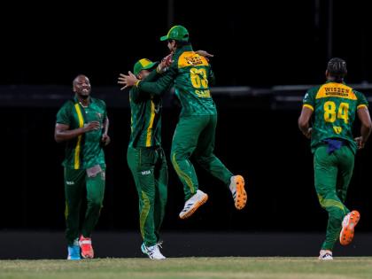 Courtesy of CPLT20 
Jamaica Kingsmen celebrate a wicket during their Republic Bank Caribbean Premier League cricket game against the Guyana Amazon Warriors on Friday.