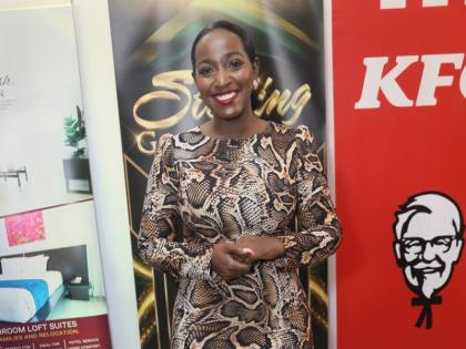 Katrina Grant-D’Aguilar, group marketing and communication manager at the Jamaica Co-operative Credit Union League, makes a stylish statement in a brown-and-black snakeskin-print long-sleeve midi dress with a ruffled hem.