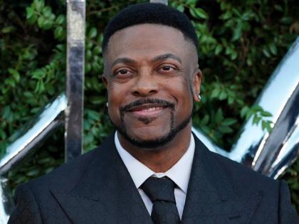 Actor and comedian Chris Tucker smiles for the lens.