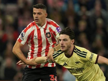 Sunderland’s Granit Xhaka (left) and Arsenal’s Declan Rice challenge for the ball during the English Premier League football match in Sunderland, England on Saturday.