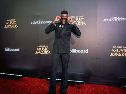 V’ghn, winner of Jab Artiste of the Year and Jab Song of the Year for his collaboration with Terra D Governor, is polished in a classic tailored double-breasted suit.