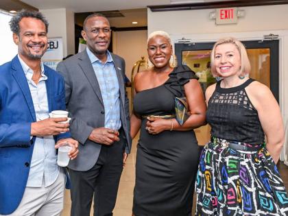 Fruit Blossoms CEO Kadeen Harvey (second right) joins JMEA executives (from left), Director Damion Dodd, Deputy President Cecil Foster and President Kathryn Silvera, for a group photo. 
