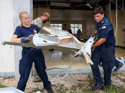 
Specialist personnel from the UK’s Royal Navy ‘HMS Trent’ assisting hospital workers at the Falmouth Hospital in Trelawny after Hurricane Melissa.