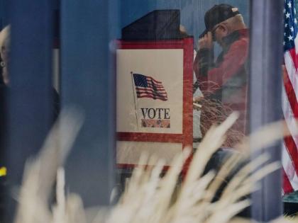 A voter casts a ballot on the first day of early voting in Minnesota at the Elections & Voter Services building on September 18, 2026, in Minneapolis. 