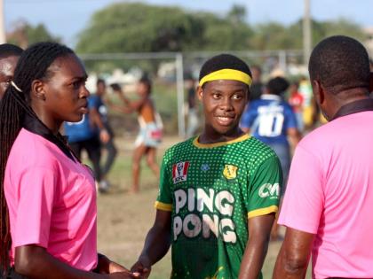 Old Harbour High’s Rayjay Smith interacting with match officials after their 2-1 victory over St Elizabeth Technical High in the Ben Francis Cup KO football match at the Linval Dixon Oval last Saturday. 