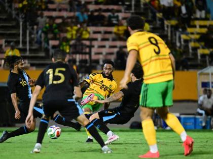 Reggae Boy Renaldo Cephas (centre) takes a shot at goal during last Friday’s Concacaf Nations League match against Guatemala at the National Stadium. Cephas scored the winner in Jamaica’s 3-2 victory.