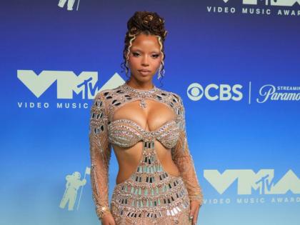 Chloe Bailey brings maximum heat to the red carpet in a sheer, jewel-encrusted Idan Cohen piece.