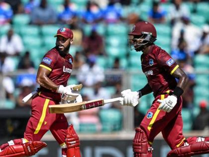 John Campbell (left) and Justin Greaves go for a run during their partnership of 135 against India on Sunday. Greaves scored 101.