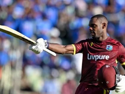 Justin Greaves celebrates scoring his maiden One-Day International century against India on Sunday.