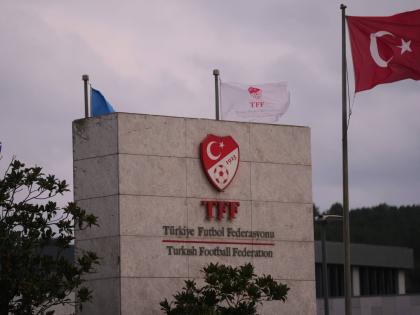 A Turkish flag waves at the Turkish Football Federation headquarters, in Istanbul on November 12, 2025. 