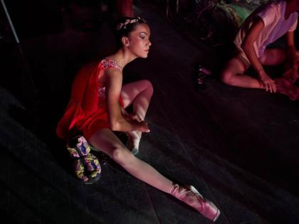 A dancer from the National Ballet of Cuba adjusts her ballet shoes before rehearsal in Havana, Cuba, August 21.