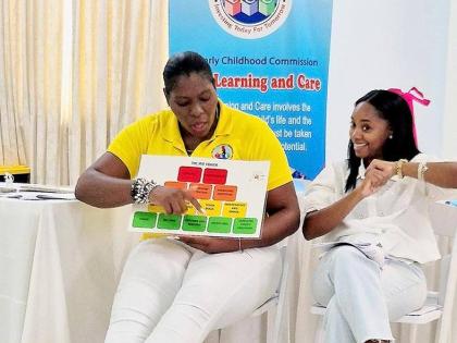 ECC officers participate in an Irie Tower exercise during Irie Homes Toolbox training, exploring positive, non-violent strategies to support children’s behaviour and development.