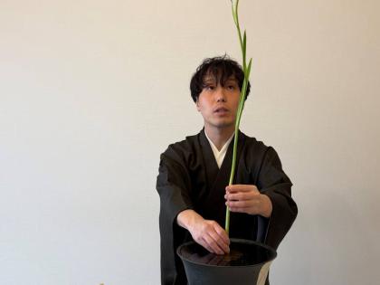 Ikenobo ikebana instructor Hiroyuki Okada demonstrates a basic flower arrangement style called ‘Shoka Shofutai’ at a studio in Tokyo. 