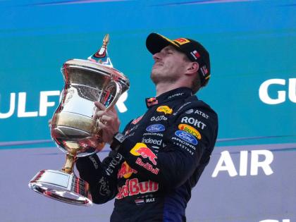 Red Bull driver Max Verstappen of the Netherlands celebrates on the podium after winning the Bahrain Grand Prix in Sepang, Malaysia, Sunday, October 4, 2026. 