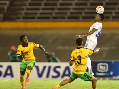  Honduras defender Joseph Rosales  (right) heads the ball while being closely watched by Jamaica's Kaheim Dixon (left) and Brandon Cover during last Monday's Concacaf Nations League match at the National Stadium. Honduras won 1-0. 