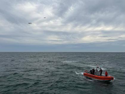 In this photo released by U.S. Coast Guard, crew members search by air and on the water for a Boston-bound air ambulance that vanished off the coast of Nantucket, Massachusetts, on Saturday, Oct. 3, 2026. (U.S. Coast Guard via AP)