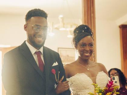 Deneal makes her way down the aisle, escorted by her brother, Devonte Gordon.