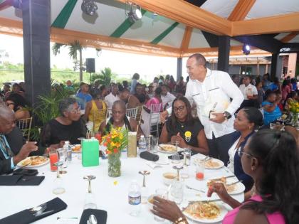 Health and Wellness Minister Dr Christopher Tufton interacts with healthcare workers from the Southern Regional Health Authority during an appreciation gala last week.