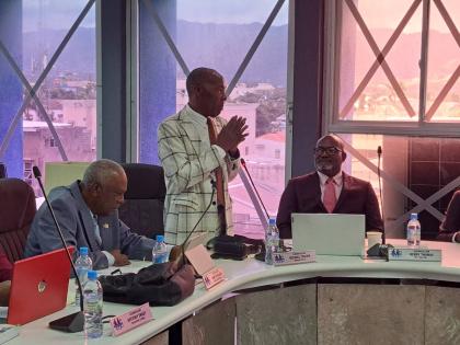 Michael Troupe (centre), councillor for the Granville division in the St James Municipal Corporation, addresses the monthly meeting of the corporation last Thursday. Also pictured are Martin Kellier (left), councillor for the Welcome Hall division, and Ker