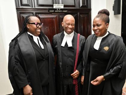From left: Director of Public Prosecutions Claudette Thompson, KC; Oswest Senior-Smith, KC; and Deputy Solicitor General Lisa White,  KC, share a laugh during a conversation after they were admitted to the Inner Bar during a ceremony at the Supreme Court o