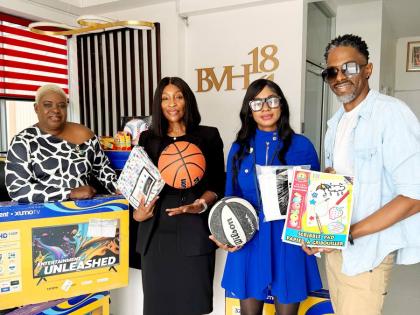 Representatives display recreational and arts-and-crafts supplies donated to Bellevue Hospital by City of Lauderhill Mayor Denise Grant and Vice Mayor Richard Campbell. From left are Annmarie Madden, director of public relations, Jamaica Ex-Soldiers Associ