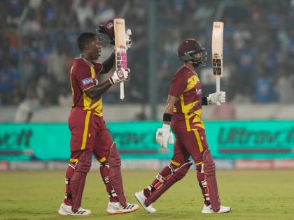 West Indies’ captain Shai Hope (right) celebrates his century as Sherfane Rutherford looks on during the fourth T20 cricket match between India and West Indies in Hyderabad, India, Wednesday, October 14, 2026. 