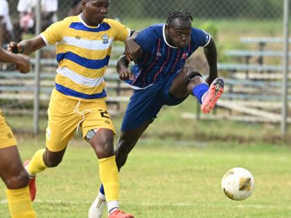 Ricardo Makyn /Chief Photo Editor
Molynes United’s Dhumar McLaughlin (left) tries to stop the challenge of Dunbeholden’s Marlon Allen during a Jamaica Premier League football match at Dunbeholden on October 11.