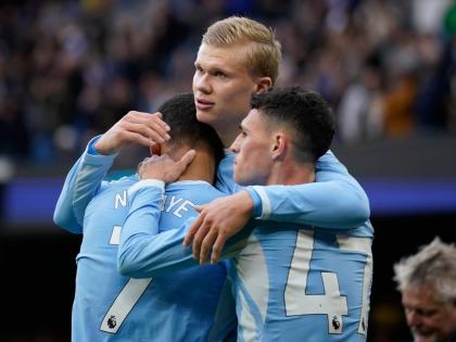 AP 
Manchester City’s Erling Haaland celebrates with his teammates Phil Foden and Iliman Ndiaye after scoring his side’s third goal during the English Premier League football match against Ipswich Town in Manchester, England, yesterday.