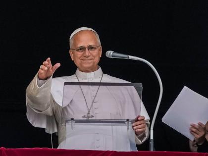 Pope Leo XIV appears at the window of his study in the Apostolic Palace overlooking St. Peter’s Square at the Vatican for the traditional noon blessing after praying the Angelus.