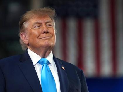 US President Donald Trump arrives to speak at a campaign rally at Truist Arena at Northern Kentucky University. 