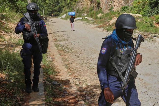 Police officers patrol the area near the Saint-Helene orphanage in the Kenscoff neighbourhood of Port-au-Prince, Haiti, Monday, August 4, 2025. (AP Photo/Odelyn Joseph)