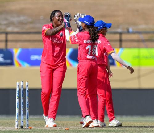 Barbados Royals Chinelle Henry (left) celebrates with teammates during their match against the Trinbago Knight Riders at the Providence Stadium in Guyana yesterday.