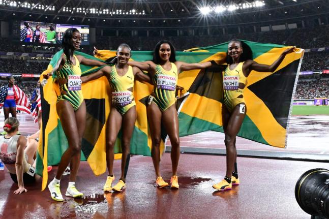 Jamaica's 4x400-metre women, from left: Dejanea Oakley, Nickisha Pryce, Stacey-Ann Williams, and Andrenette Knight celebrate the silver medal they won at the World Athletics Championships. The Jamaicans clocked 3:19.25.