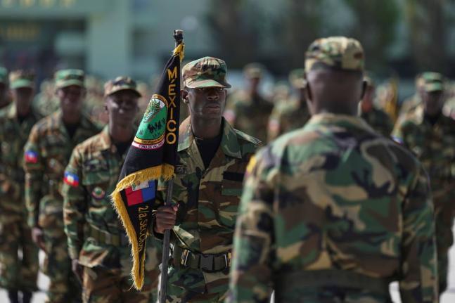 Haitian soldiers attend a closing ceremony at the end of their military training provided by the Mexican Army, in San Miguel de los Jagüeyes, Mexico.
