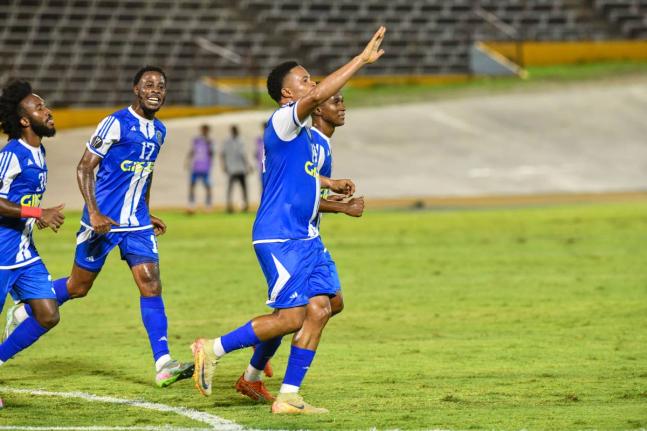 Sue-lae McCalla of Mount Pleasant FA (right) celebrates with his teammates after scoring the first goal of the Concacaf Caribbean Cup match against SV Robinhood at the National Stadium in Kingston on August 19.