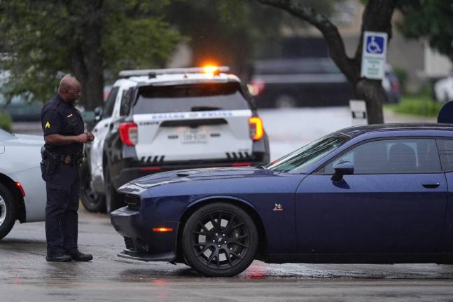 Police block off the street close to a US Immigration and Customs Enforcement office after a reported shooting, in Dallas on Wednesday, September 24, 2025. (AP Photo/Julio Cortez)