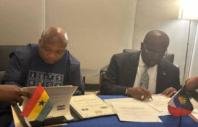 Antigua's Foreign Affairs, E.P. Chet Greene (right) and Minister of Foreign Affairs of Ghana, Samuel Ablawka, signing a visa waiver agreement.