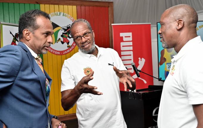 
Alfred ‘Frano’ Francis (centre), race director of Reggae Marathon, in conversation  with Dr Carey Wallace (left), executive director of Tourism Enhancement Fund, and Ian Kelly, chairman of Reggae Marathon, at the 2025 Reggae Half Marathon, 10K and 5K 