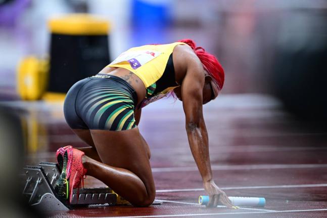 Shelly-Ann Fraser-Pryce gets ready to puh out of the blocks for the very last time during the women's 4x100-metre final at the World Athletics Championships inside the Japan National Stadium.