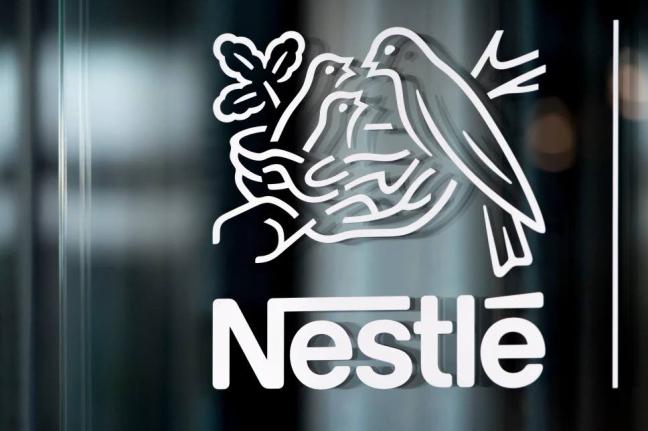 In this Thursday, February 14, 2019, file photo, Nestle’s logo is displayed on a window, during the 2018 full-year results press conference of the food and drinks giant Nestle, in Vevey. 