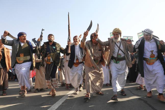 Houthi supporters dance as they celebrate following the announcement that Israel and Hamas have agreed to the first phase of a peace plan to pause the fighting, in Sanaa, Yemen.