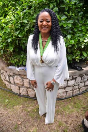 Dr Trisha Bailey, philanthropist and entrepreneur, poses for the camera after her conferment of an Order of Distinction in the Commander class at the National Honours and Awards Ceremony on October 20.
