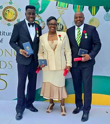 From left: Sylvanus Thompson, Vivienne Nelson-Campbell and Chris Campbell pose with their awards on Monday.