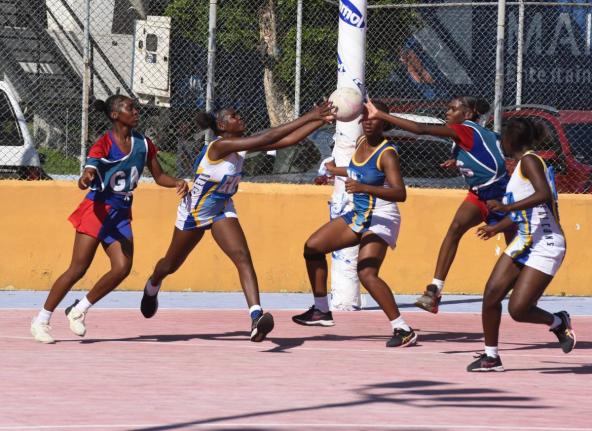 Camperdown High players (blue and red) and their Gaynstead opposition get into a scramble for the ball during an ISSA urban schoolgirl senior netball game at the Leila Robinson Courts last year.