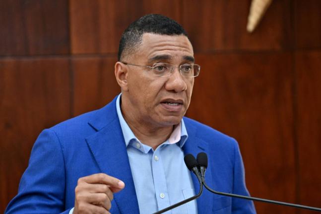 Prime Minister Dr Andrew Holness addresses a special Jamaica House press briefing, looking at preparations for Tropical Storm Melissa, in St Andrew yesterday.