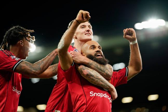 
Manchester United’s Bryan Mbeumo (right) celebrates with Benjamin Sesko (centre) after scoring his side’s third goal during the English Premier League football match against Brighton & Hove Albion in Manchester, England, yesterday.
