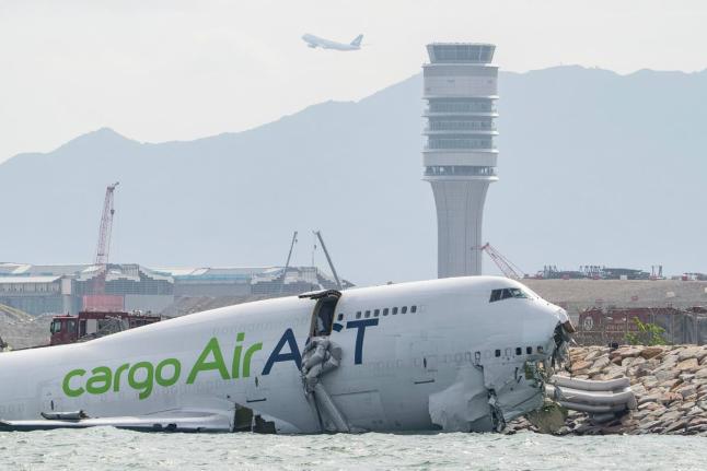The cargo aircraft that skidded off a Hong Kong airport runway.