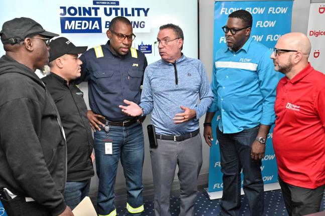 Officials of the Jamaica Public Service, Digicel, Flow, National Water Commission, and National Works Agency at a joint news conference on Hurricane Melissa on October 26, 2025. 