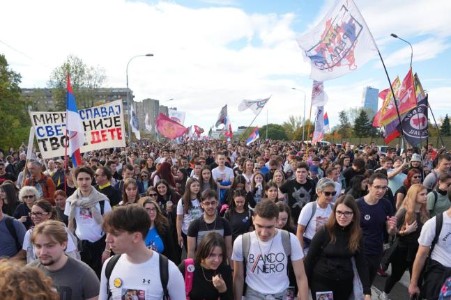People gather, among them students, to walk on the street towards the northern city of Novi Sad, for a huge rally on November, marking the first anniversary of a train station disaster that killed 16 people, in Belgrade, Serbia.