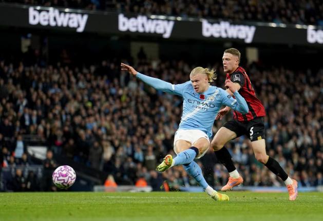 Manchester City’s Erling Haaland scores his sides first goal during the English Premier League match against Bournemouth in Manchester, England, yesterday.